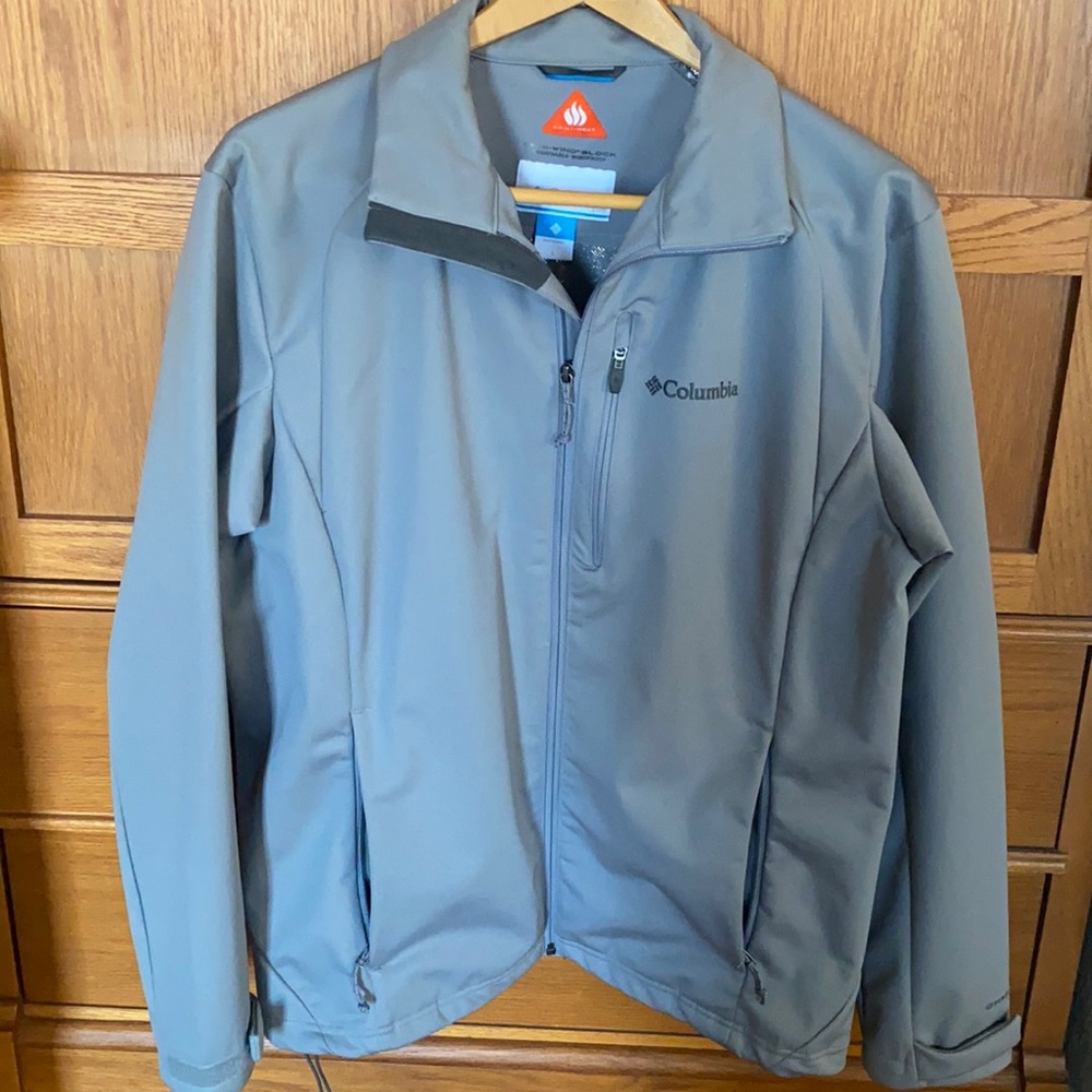 Columbia zip winter jacket with adjustable wrist Velcro.